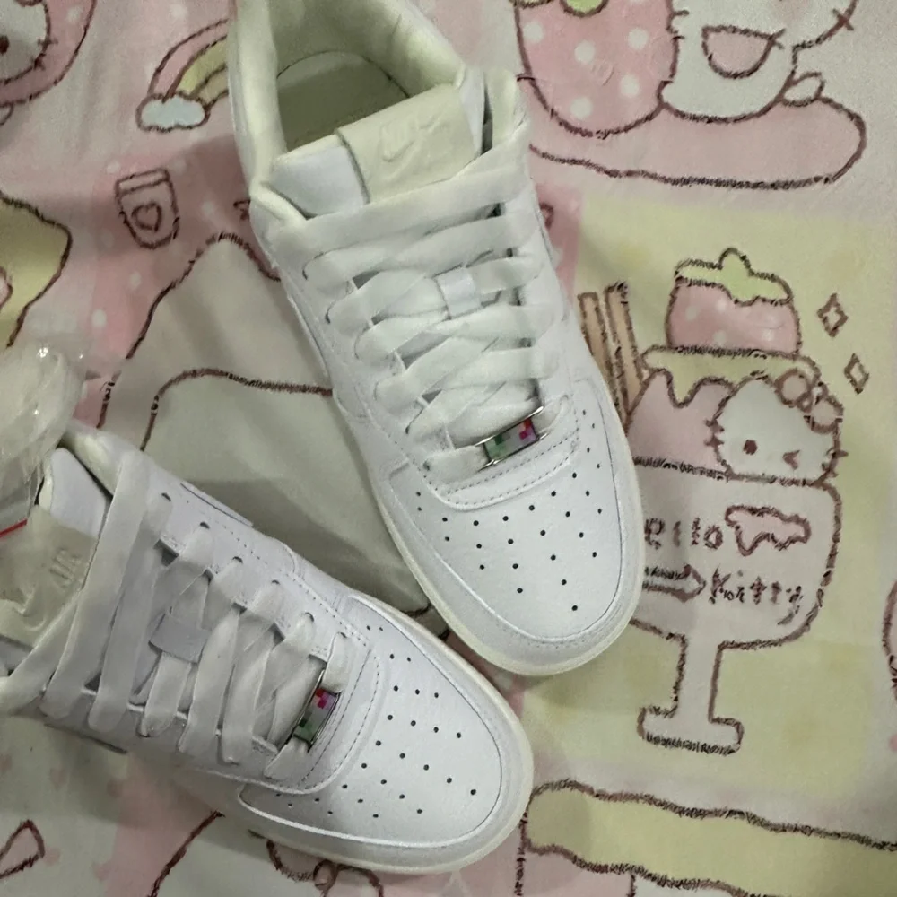 Nike Men’s White Sneakers with Pink Heel Accent